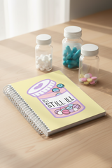 Bound Journal with a pill bottle on the cover that reads Still Ill